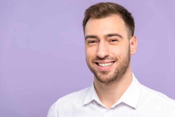 stock-photo-handsome-man-smiling-isolated-violet
